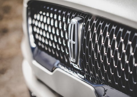 The grille of the 2024 Lincoln Aviator® Reserve model with an eye-catching repeated field of Lincoln Star logo shapes | White's Canyon Motors - Lincoln in Spearfish SD