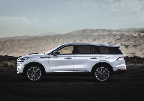 A Lincoln Aviator® SUV is parked on a scenic mountain overlook | White's Canyon Motors - Lincoln in Spearfish SD