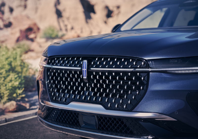 The stylish grille of a 2024 Lincoln Nautilus® SUV sparkles in the sunlight. | White's Canyon Motors - Lincoln in Spearfish SD