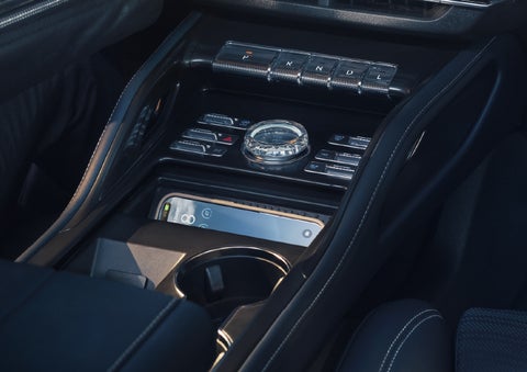 A smartphone is shown charging in the wireless charging pad. | White's Canyon Motors - Lincoln in Spearfish SD